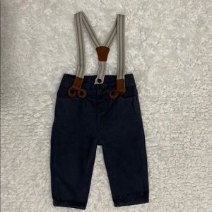 Baby boy’s Osh Kosh gray pants with suspenders.